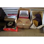 Three boxes of various lamp shades materials and o