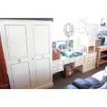 A bedroom suite comprising of a two door wardrobe;