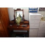 A mahogany mirror back dressing table fitted two d