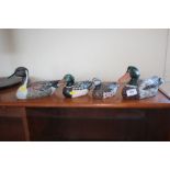 Four wooden ducks