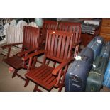 A drop leaf hardwood garden table and a set of fou