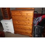 A modern pine chest fitted two short over four lon