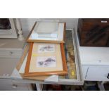 A quantity of prints and picture frames