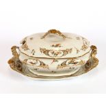 An extensive 19th Century Limoges dinner service, comprising graduated meat plates, covered tureens,