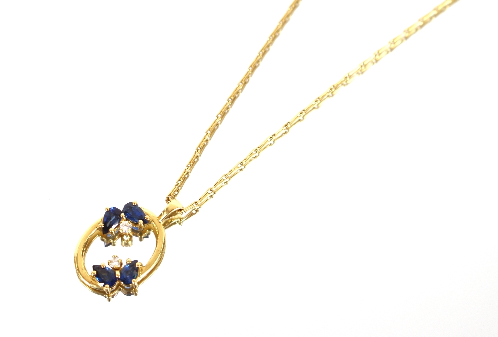 An 18 carat gold link chain, with pear shaped sapphire and diamond set oval pendant, total weight