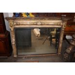 A Regency gilt framed overmantel mirror, having inverted breakfront pediment above columns, with