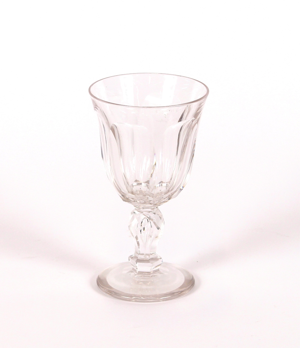 A suite of early 20th century dimpled table glasses, raised on faceted baluster stems and spread