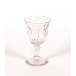 A suite of early 20th century dimpled table glasses, raised on faceted baluster stems and spread