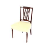 A Sheraton period mahogany dining chair, with latticed back and reeded columns, upholstered stuff-