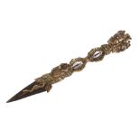 A 19th Century Tibetan ritualistic dagger, the terminal decorated with a three headed deity with