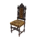 A set of six late Victorian carved oak dining chairs, in the Jacobean taste, each with mask and