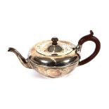 A George V silver cushion shaped teapot, having wooden handle and lift, London 1921, 13ozs. gross