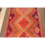 A Kelim rug, of traditional design