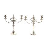 A pair of plated three light candelabra, having gadrooned border decoration, 44cm high
