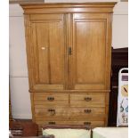 A late Victorian satin ash linen press, the upper section fitted sliding trays with two short and