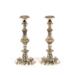 An ornate pair of Gorham silver plated candlesticks, having separate sconces, 28cm high