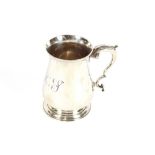 A George III silver baluster tankard, having C scroll handle, bearing monogram, London 1776, 11.