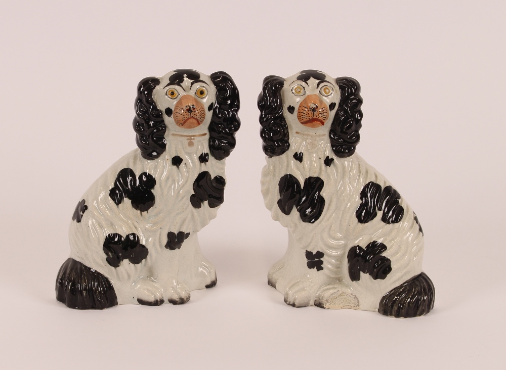 Four pairs of Victorian Staffordshire black and white spaniel ornaments; and a larger similar