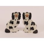 Four pairs of Victorian Staffordshire black and white spaniel ornaments; and a larger similar