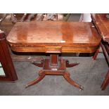 A 19th Century rosewood card table, the brass strung fold-over swivel top raised on a tapering