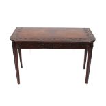 A 19th Century carved mahogany demi lune hall table, profusely decorated with leaves and foliage,