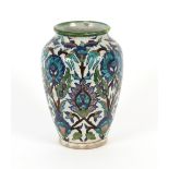 An Antique Persian vase, having cobalt blue and green decoration of flowers and birds, 24cm high