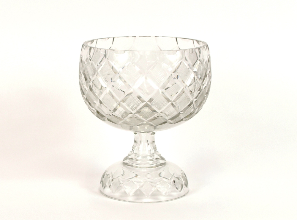 A good quality heavy cut glass fruit bowl, of hobnail pattern, raised on a circular spread foot,