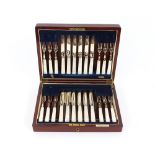 A cased set of 12 each plated and mother of pearl handled fruit knives and forks, contained in a