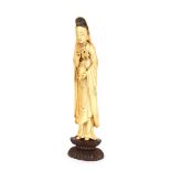 An Antique Japanese ivory figure of a maiden, carrying a vase and flower, 23cm high
