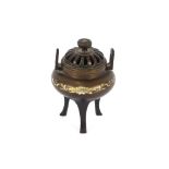 A Japanese Meji period bronze Koro, having loop handles and pierced cover inlaid yellow and white