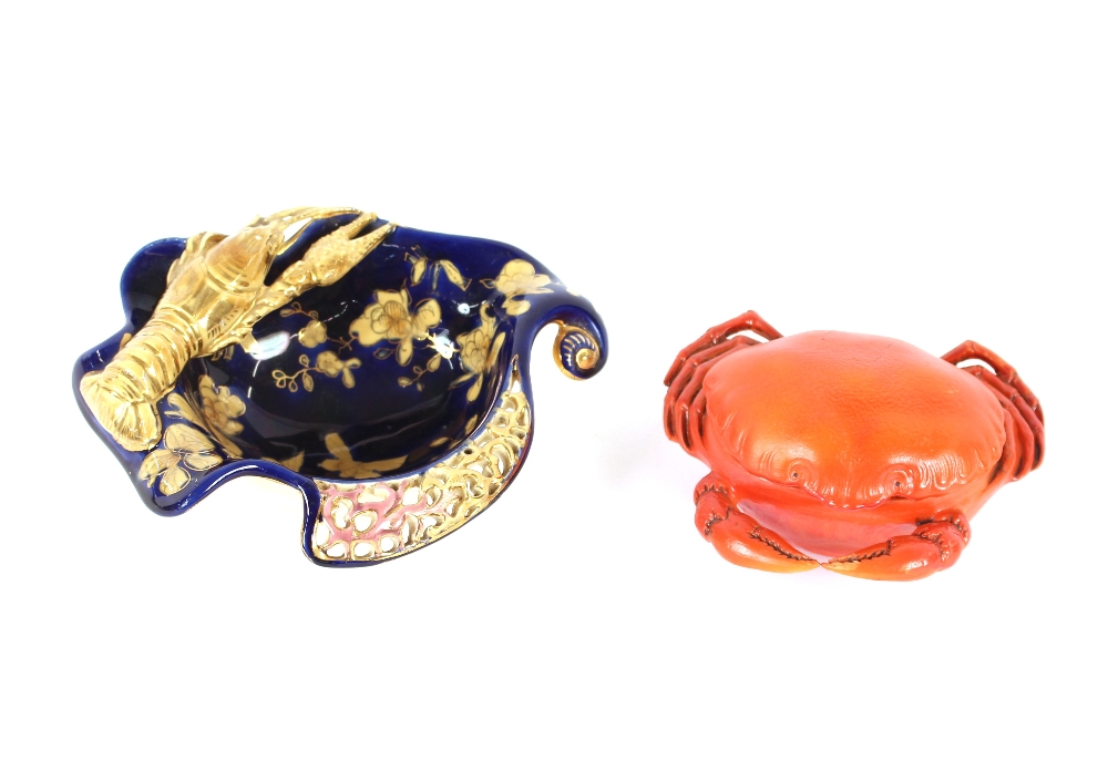 A Continental pottery pot and cover, in the form of a crab, of bright orange colour, 11cm; and a