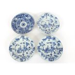 Three 19th Century Chinese shallow blue and white dishes, decorated with figures in an exotic garden