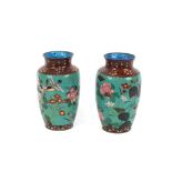 A pair of 19th Century Japanese cloisonne baluster vases, profusely decorated with birds and foliage