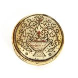 A rare 18th Century circular ivory snuff box, the lid with pique work decoration depicting a vase of