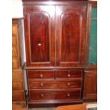A Victorian mahogany press cupboard, the upper section fitted with a single tray and converted to