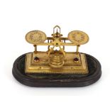 A set of fine quality 19th Century presentation gilded Postal scales, the oval pans with engraved