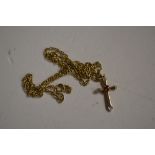 A 9ct gold cross pendant hung to a 9ct gold chain