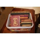 A small tub of leather bound books