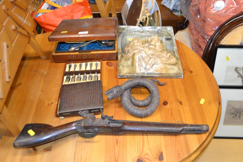 A quantity of various cutlery; a plaster plaque etc.