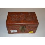 An Oriental carved wooden box and a white metal sp