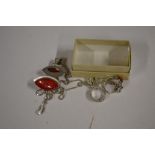 A small box of silver jewellery to include an ambe