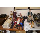 A collection of various dolls and figures