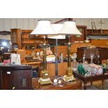 A pair of large brass Corinthian column table lamp