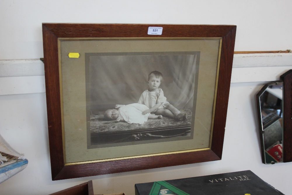 An oak framed portrait of two children