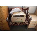 An oak and upholstered hall bench raised on turned