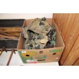 A box containing various army tactical vests