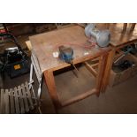 A work bench with vice and Black & Decker bench gr