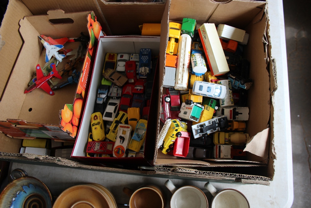 A box of various die cast toys