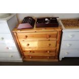 A modern pine chest fitted four drawers