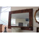 A large pine framed bevel edge wall mirror
